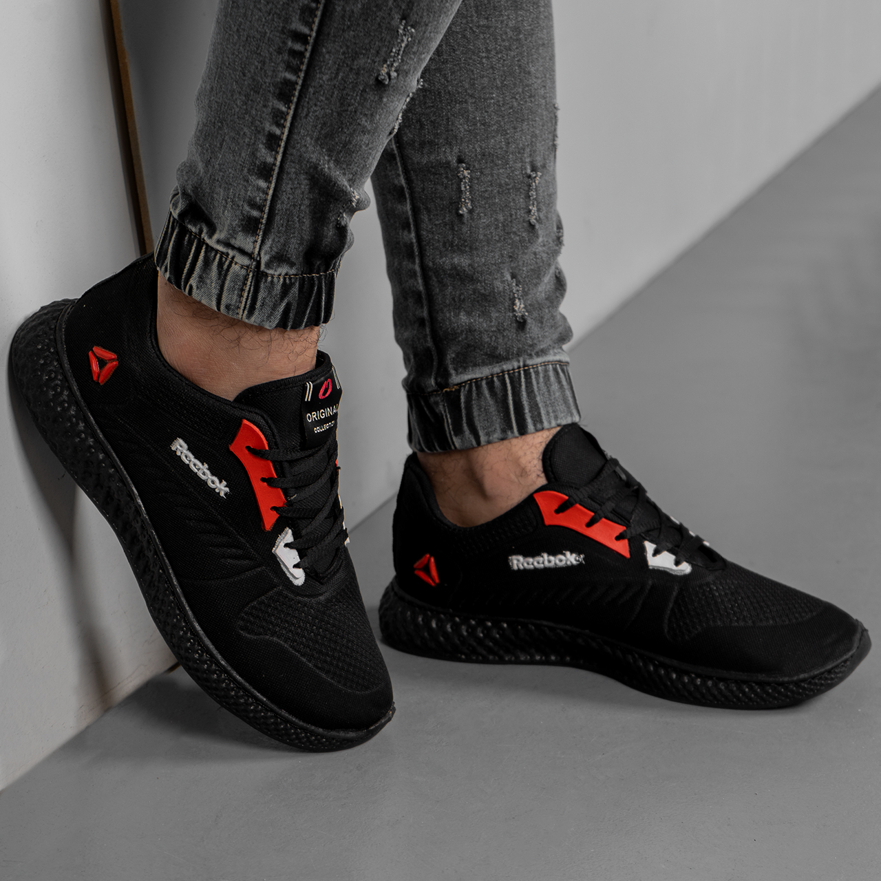 کفش ورزشی (T)مشکی قرمز ریبوک مردانه مدل مدلDanosh