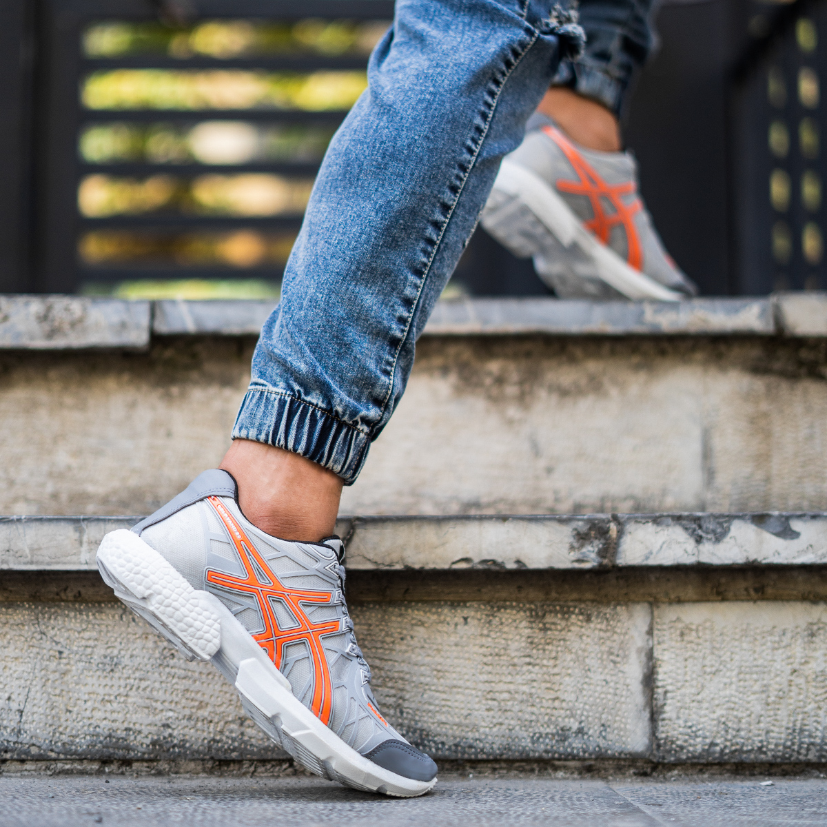 کفش ورزشی Asics مردانه طوسی نارنجی مدل Snopy